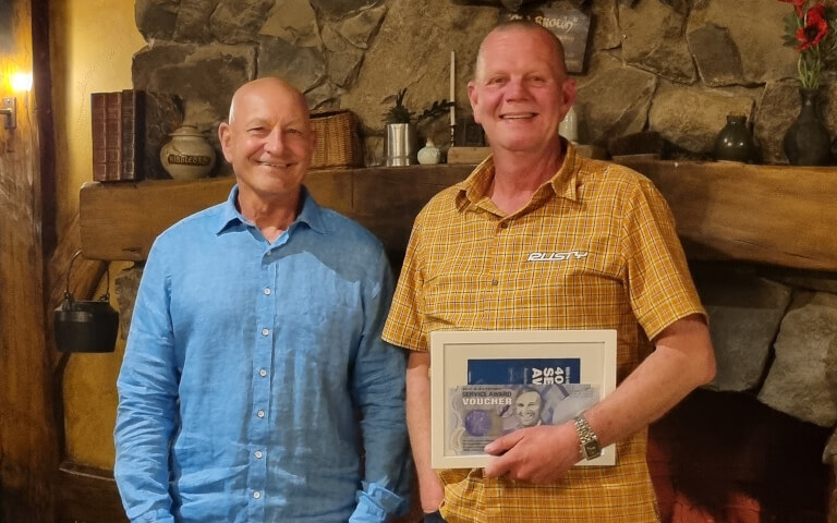 Bob and Martin receives their award at Reid & Harrison